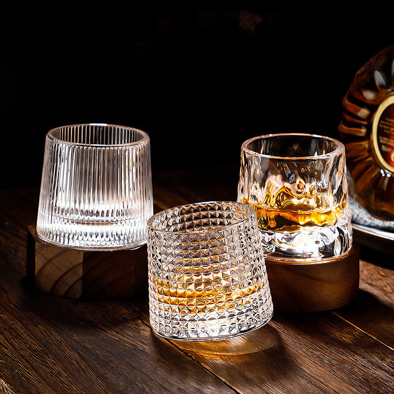 Thickened rotating tumbler whiskey glass